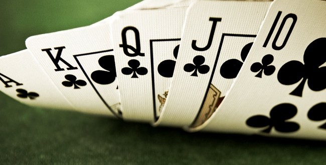 Image of a five-card poker hand, specifically a royal flush with clubs